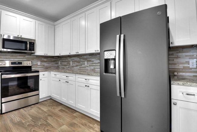Kitchen features upgraded stainless appliances | Image 9
