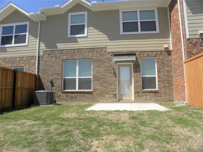 Back of house with brick siding and a patio area | Image 31