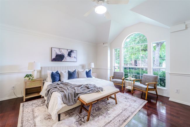 Bedroom featuring lofted ceiling, wood-type flooring, and ceiling fan | Image 24