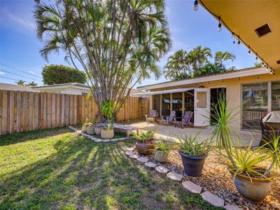 This lovely home is set on a spacious fenced lot with a patio overlooking the garden. | Image 1