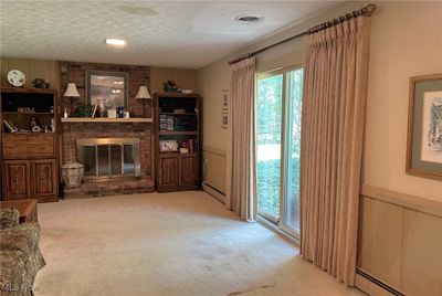 The Family Room has a gas fireplace and patio doors to the back yard. | Image 3