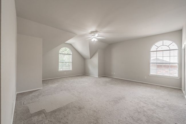 Primary bedroom with windows offering lots of natural light. | Image 22