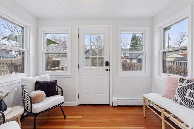 The kitche leads to the sparkling sunroom, which bridges the space from the home to the garage and backyard. | Image 19