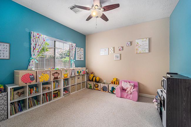 Adorable secondary bedroom with great closet space. | Image 19