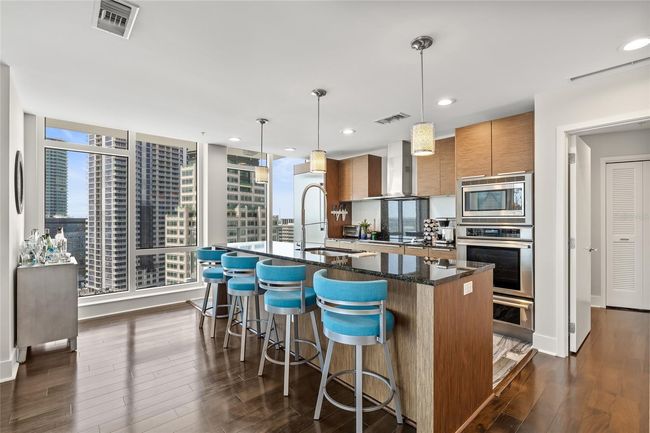 Oversized kitchen island with built in appliances | Image 15