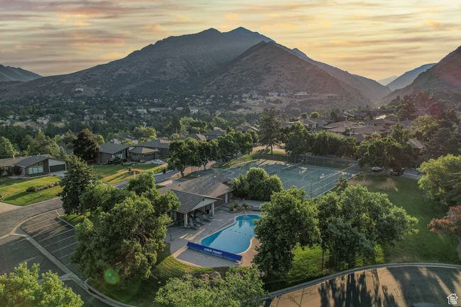 Aerial view at dusk of view of pool, a mountain view, and a residential view | Image 41