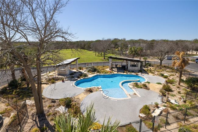 View of swimming pool with a fenced backyard, a pergola, a fenced in pool, and a patio | Image 23