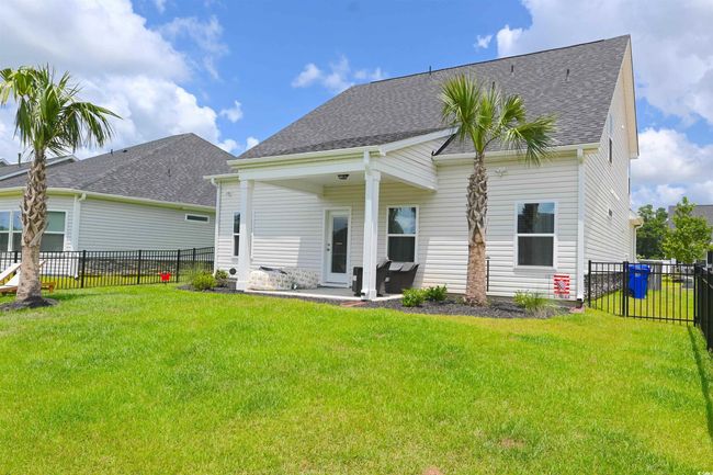 Back of house with roof with shingles, a fenced backyard, and a patio | Image 31