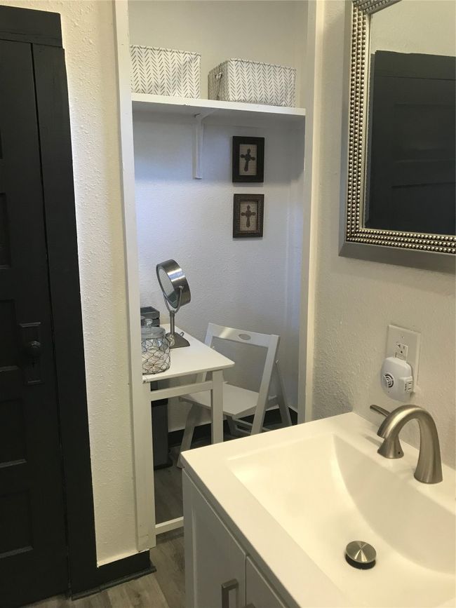 Bathroom featuring a textured wall, wood finished floors, and a sink | Image 21