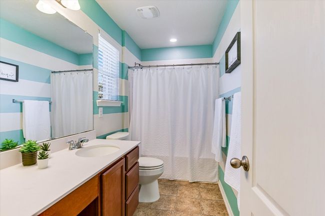 Bathroom featuring toilet and vanity | Image 22