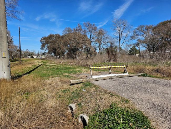 Colvert and driveway on each end. | Image 4