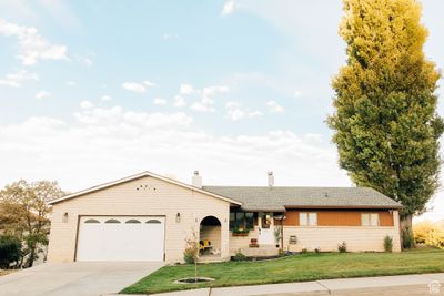 Ranch-style home with archway entrance | Image 1