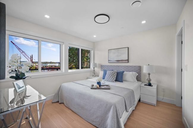 Bedroom featuring light wood-type flooring and recessed lighting | Image 13