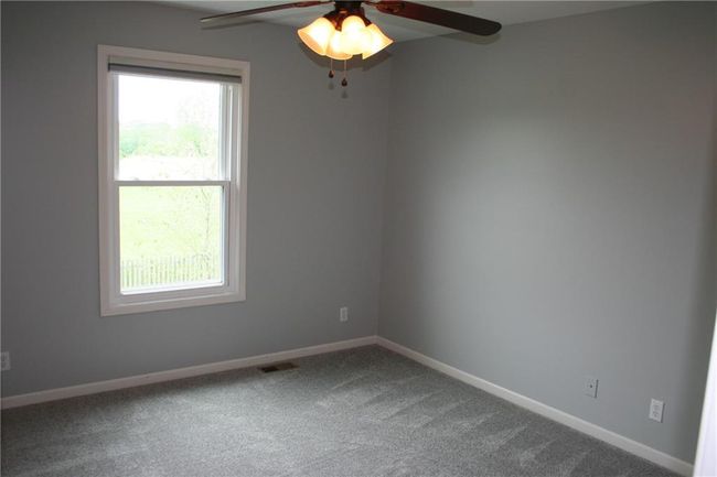 Spare room with carpet and ceiling fan | Image 11