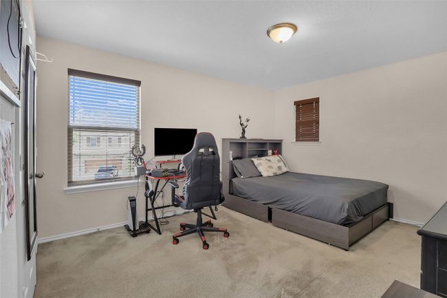 Bedroom featuring carpet flooring and baseboards | Image 23