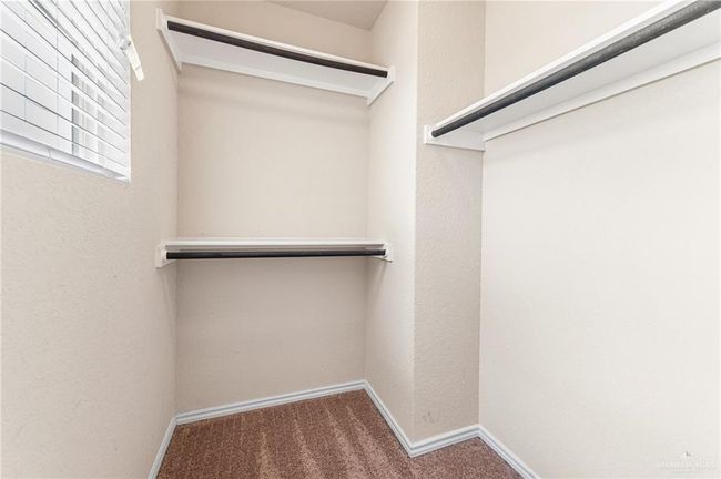 Spacious closet featuring carpet | Image 27