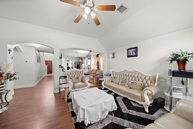 The arched openings give the room character and help the whole main floor feel open and connected—so whether you're cooking, relaxing, or entertaining, everything flows together. | Image 4