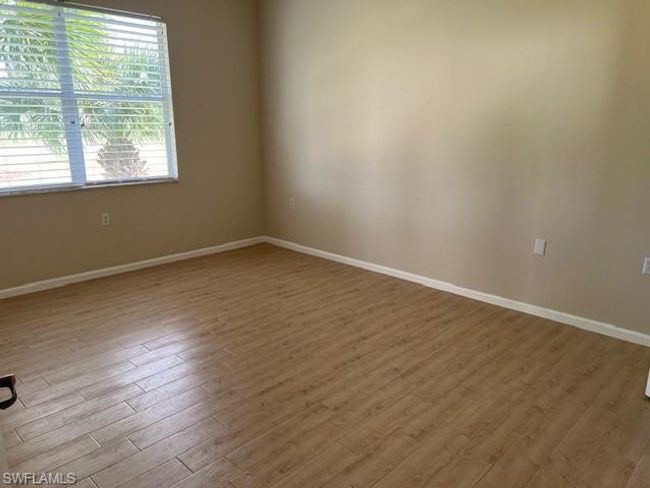 View of Primary bedroom with out furniture looking toward golf course view window. | Image 19
