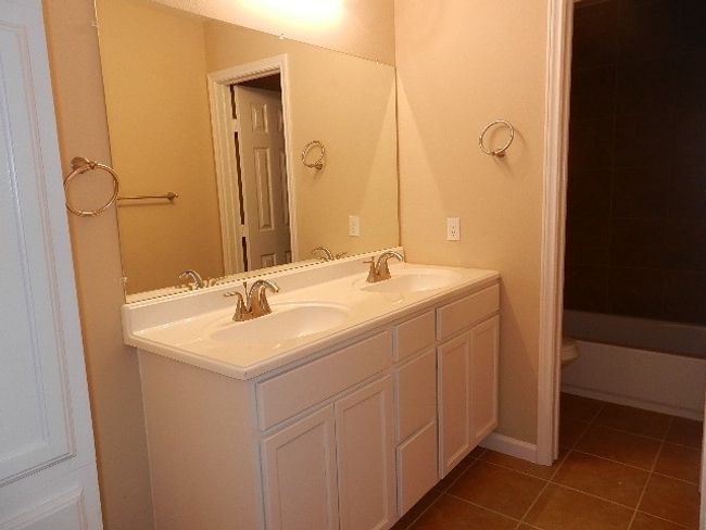Full bath with double vanity and tile patterned flooring | Image 15