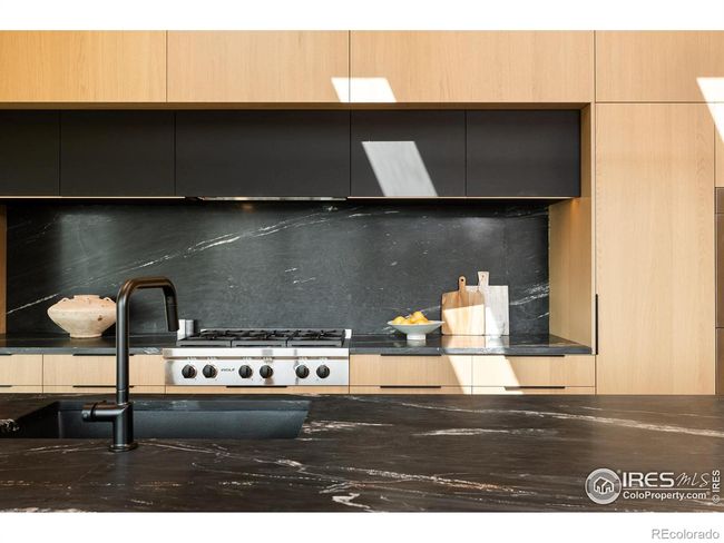 Wolf appliance package with sub-zero refrigerator, six burner gas range, double wall ovens, built-in drawer microwave, and built-in Zephyr monsoon downdraft hood | Image 10