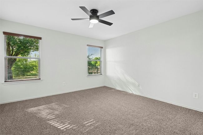 Unfurnished room with carpet floors and ceiling fan | Image 12