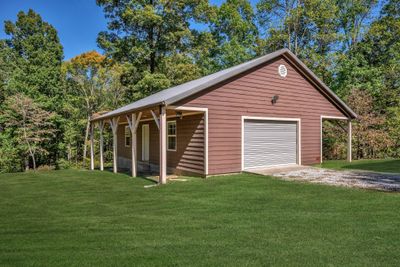 HARD TO FIND UNDER $600, 000 in Burns!!!! RECENTLY ADDED 40x24 DREAM Garage/Workshop Electricity in Place + Stubbed for Plumbing Green Grass Edits on Exterior Photos | Image 2