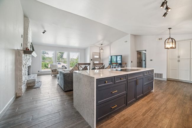 Vaulted ceilings and abundant natural light pours through the recently installed windows | Image 11
