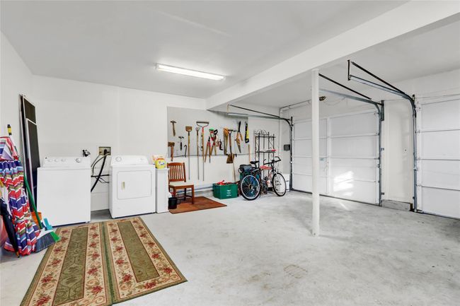 Garage featuring separate washer and dryer | Image 29