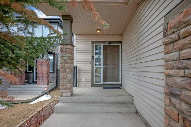 273 Panatella Boulevard Nw, Home with 3 bedrooms, 3 bathrooms and 4 parking in Calgary AB | Image 2