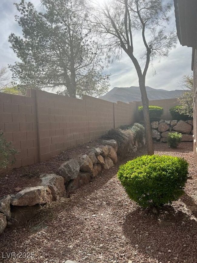 View of fenced backyard | Image 20