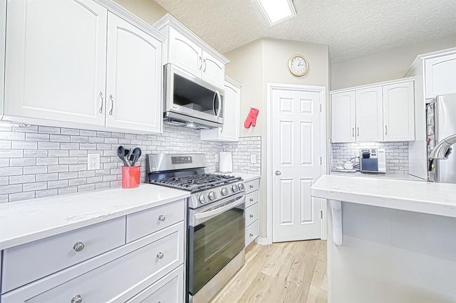 149 Bow Ridge Cres, House detached with 3 bedrooms, 3 bathrooms and 4 parking in Cochrane AB | Image 11