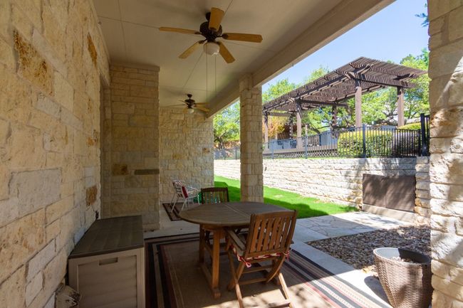 View of patio / terrace featuring fence, outdoor dining area, and a ceiling fan | Image 21