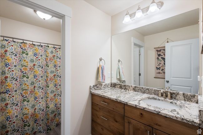 Bathroom with vanity and a shower | Image 22