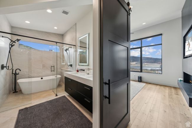 Bathroom with vanity, recessed lighting, a shower stall, and a freestanding bath | Image 35