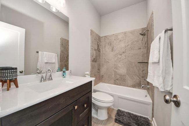 secondary bathroom with modern finishes. | Image 34