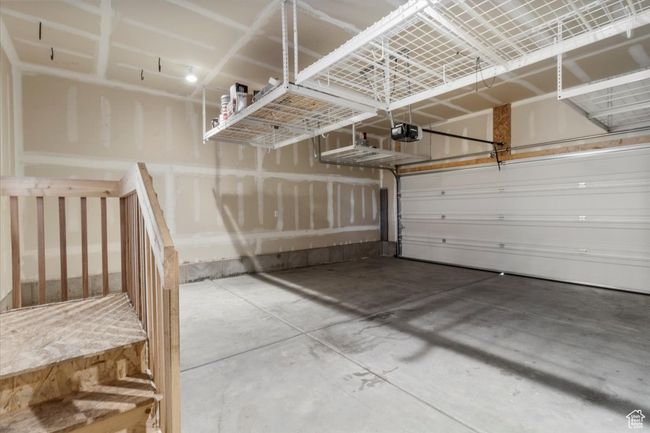 Garage featuring a garage door opener | Image 38
