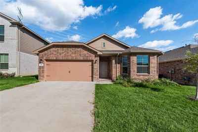 View of front of house with a front yard and a garage | Image 2