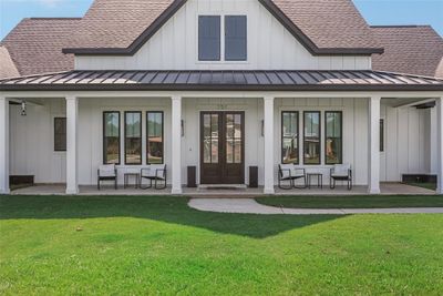 Back of house with a yard and covered porch | Image 2