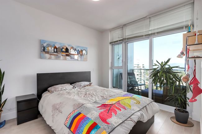 Bedroom featuring wood finished floors and baseboards | Image 11