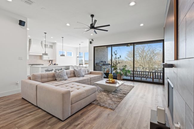 Living area featuring recessed lighting, ceiling fan, and light wood-style flooring | Image 9