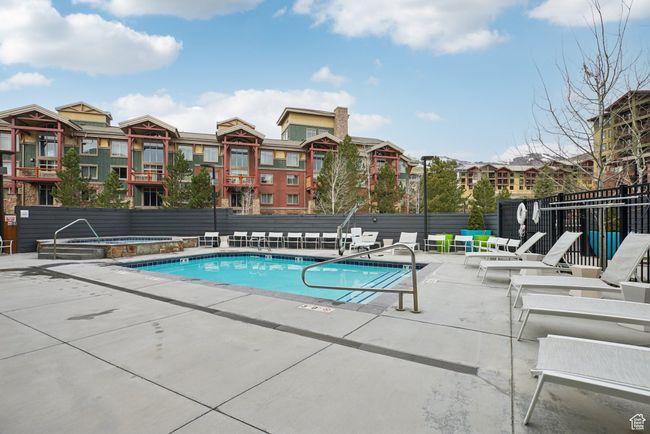 Pool with fence, a patio, and a hot tub | Image 28