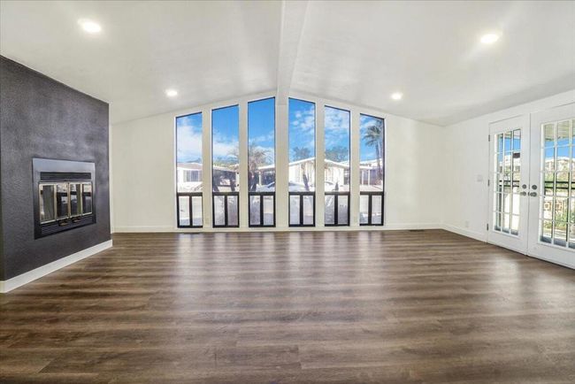 open living room with natural light | Image 15