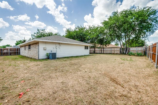 View of fenced backyard | Image 21
