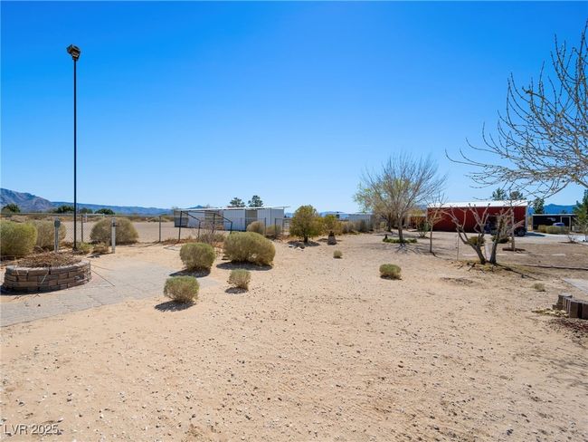 View of yard with fence and a mountain view | Image 54