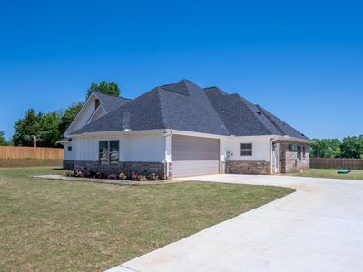 View of front of home with a garage and a front lawn | Image 3