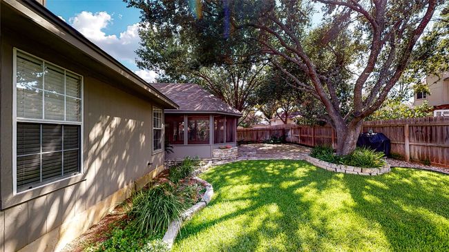 View of fenced backyard | Image 9