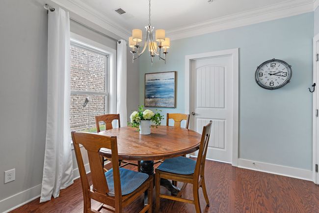 Look forward to enjoying your favorite meals in the sunlit dining room. | Image 10