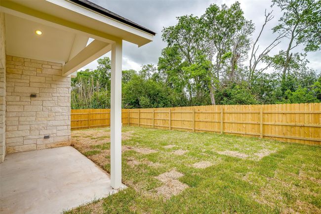 View of yard featuring a patio and a fenced backyard | Image 33