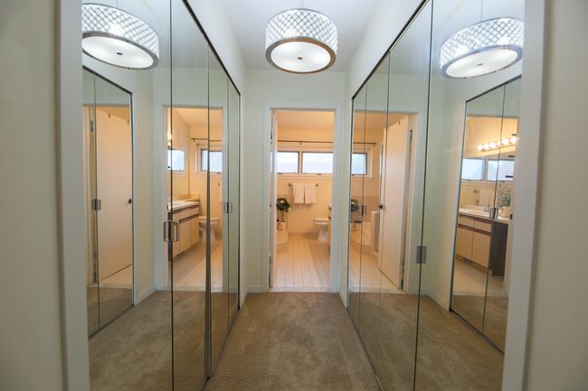 Jack/Jill walk in closets in Primary Suite. Newer lighting and custom mirrored doors. | Image 20