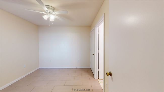 Unfurnished room with ceiling fan and light tile patterned floors | Image 11